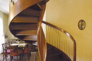 Helical spiral staircase created in Oak with bronzed spindles and helical feature outer banding on stair