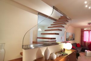 Contemporary staircase with Oak treads and Ultra clear glass walls London