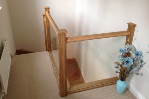 Oak and glass stair landing balustrade Ripon north yorkshire oak has been finished with natural hard wax oil