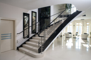 Designer art deco staircase in high black gloss and white with polished stainless steel deco style balustrade Designer art deco staircase in high black gloss and white with polished stainless steel deco style balustrade