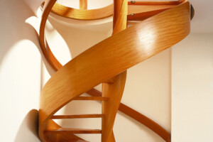 Designer helical spiral stair with helical banding in doussie Designer helical spiral stair with helical banding in doussie