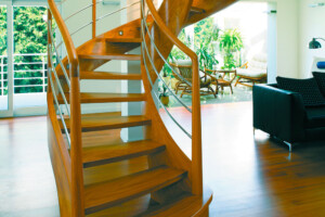 Designer helical walnut stair with stainless steel balustrade Designer helical walnut stair with stainless steel balustrade