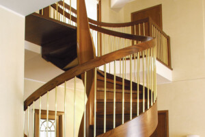 Helical spiral stair helical centre column and side band created in doussie wood with bronzed steel spindles Helical spiral stair helical centre column and side band created in doussie wood with bronzed steel spindles