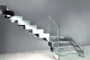 Designer zig zag stainless steel and ultra clear glass staircase with frameless ultra clear frameless glass balustrade Designer zig zag stainless steel and ultra clear glass staircase with frameless ultra clear frameless glass balustrade