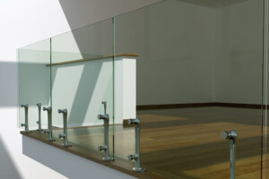 Contemporary frameless glass balustrade with stainless steel feature Contemporary frameless glass balustrade with stainless steel feature