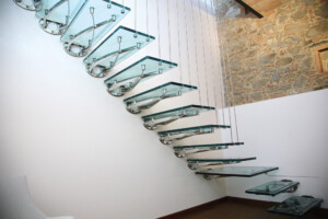 Glass floating staircase bespoke polished tread supports glass treads and polished vertical suspension rods for balustrade Glass floating staircase bespoke polished tread supports glass treads and polished vertical suspension rods for balustrade