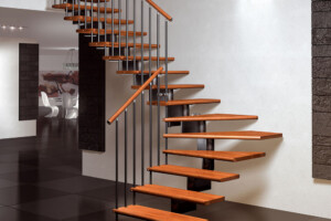 Central spine staircase modular construction beech treads and handrail with sectional centre spine an painted steel spindles Central spine staircase modular construction beech treads and handrail with sectional centre spine an painted steel spindles