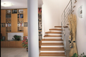 Feature oak stair treads with stainless steel traversal rods London Feature oak stair treads with stainless steel traversal rods London