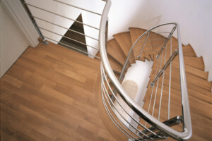 Feature oak stair treads with stainless steel traversal rods top view London Feature oak stair treads with stainless steel traversal rods top view London