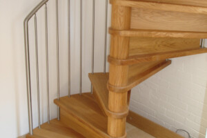 Oak closed riser spiral staircase brushed stainless steel spindles and a natural hardwax oil finish Lake Windermere Lake District Oak closed riser spiral staircase brushed stainless steel spindles and a natural hardwax oil finish Lake Windermere Lake District