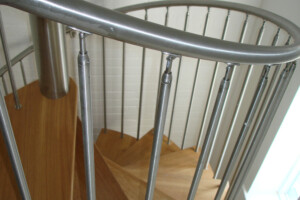 Oak spiral staircase closed riser brushed stainless steel spindles natural hardwax oil finish Lake Windermere Lake District Oak spiral staircase closed riser brushed stainless steel spindles natural hardwax oil finish Lake Windermere Lake District