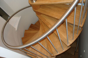 Oak spiral staircase with stainless steel spindles brushed finish set in a circular turret with wall mounted stainless steel handrail Wetherby Leeds Yorkshire Oak spiral staircase with stainless steel spindles brushed finish set in a circular turret with wall mounted stainless steel handrail Wetherby Leeds Yorkshire