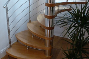 oak petal shaped treads for this designer oak spiral staircase with polished stainless steel traversal rods and handrails oak petal shaped treads for this designer oak spiral staircase with polished stainless steel traversal rods and handrails